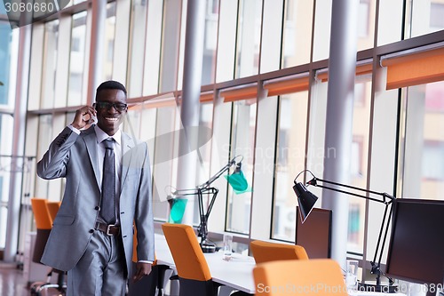 Image of African American businessman talk by phone