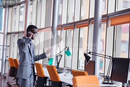Image of African American businessman talk by phone