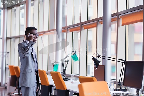 Image of African American businessman talk by phone