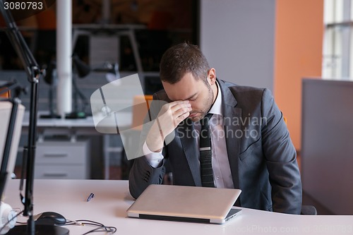 Image of frustrated young business man