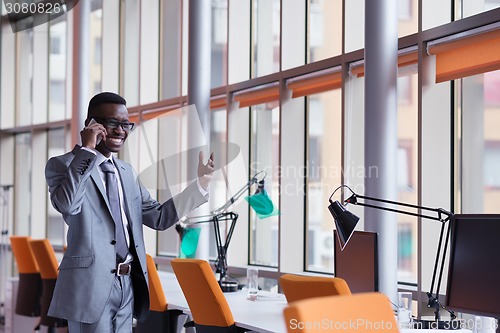 Image of African American businessman talk by phone