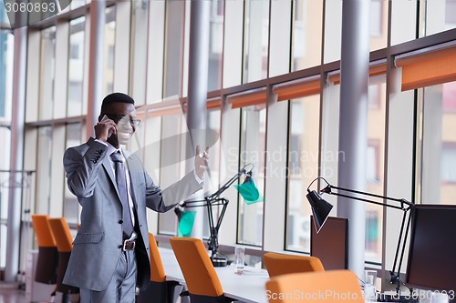 Image of African American businessman talk by phone