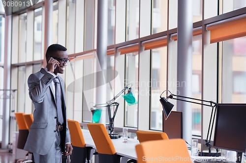 Image of African American businessman talk by phone