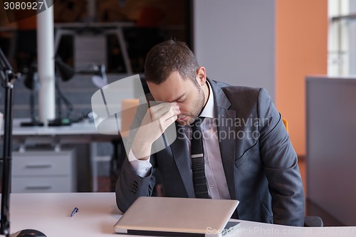 Image of frustrated young business man