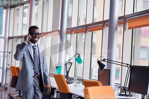 Image of African American businessman talk by phone