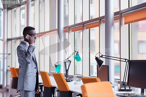 Image of African American businessman talk by phone