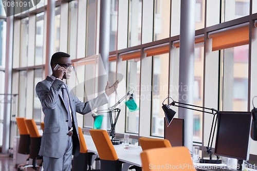 Image of African American businessman talk by phone