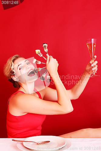 Image of Happy Woman Holding a Fan of Fork and Wine Glass