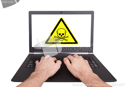 Image of Man working on laptop, toxic