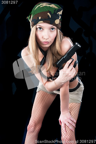 Image of Pretty woman with gun