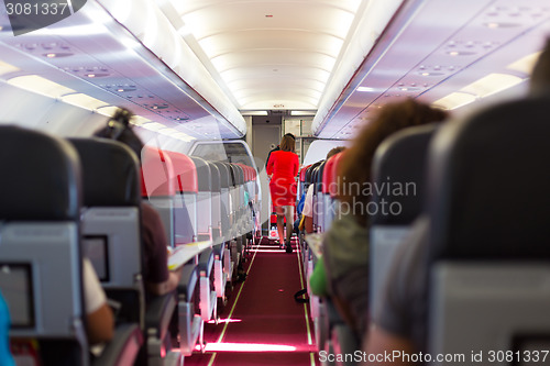 Image of Stewardess on the airplane.