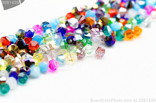 Image of Beautiful glass beads closeup on white background