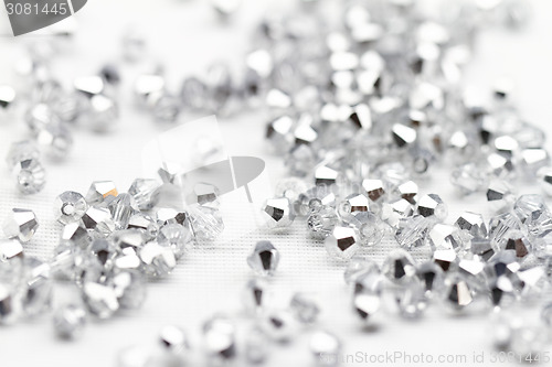 Image of Beautiful glass beads closeup on white background