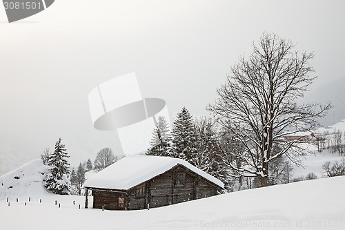 Image of Barn on Snowy Field