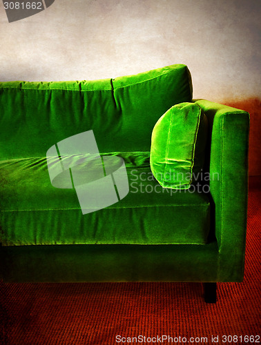 Image of Green retro sofa in a room