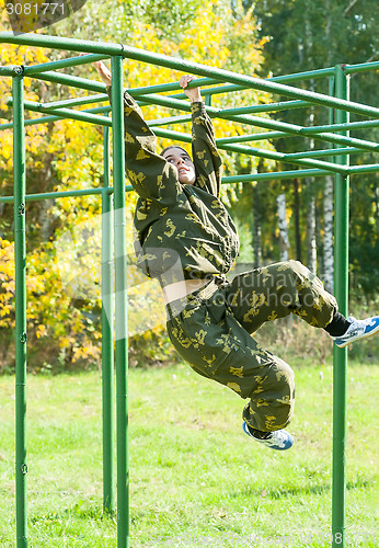 Image of Teenage girl on climbing frame in relay