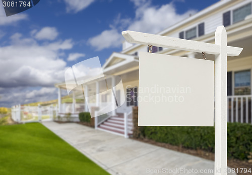 Image of Blank Real Estate Sign in Front of New House 