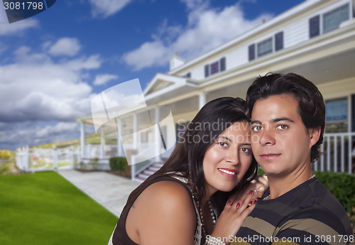 Image of Happy Hispanic Young Couple in Front of Their New Home