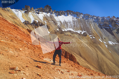 Image of Hiker on colored mountain