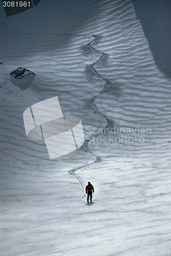 Image of Male skier riding down the hill