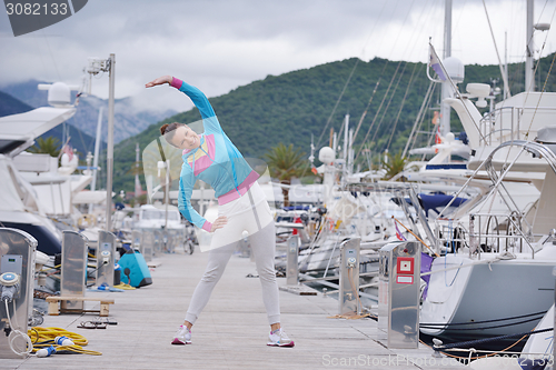 Image of woman jogging in marina