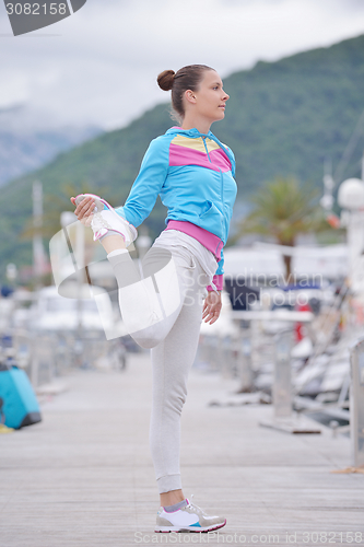 Image of woman jogging in marina