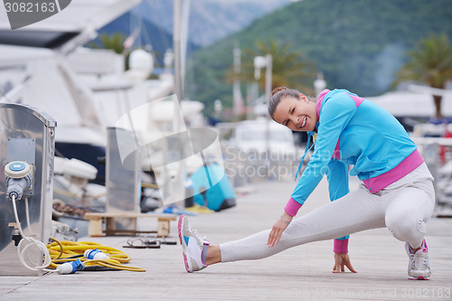 Image of woman jogging in marina