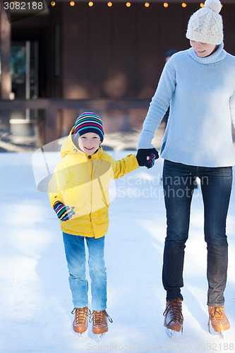 Image of family ice skating