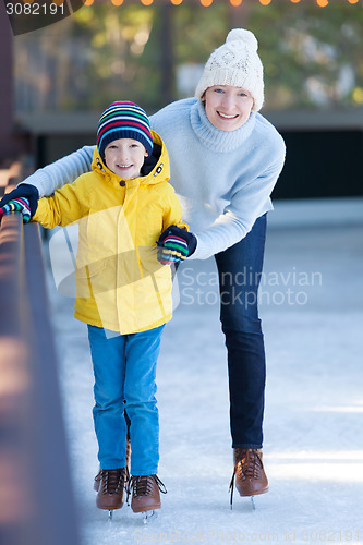 Image of family ice skating