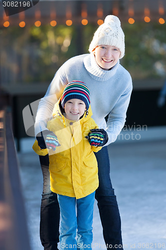 Image of family ice skating