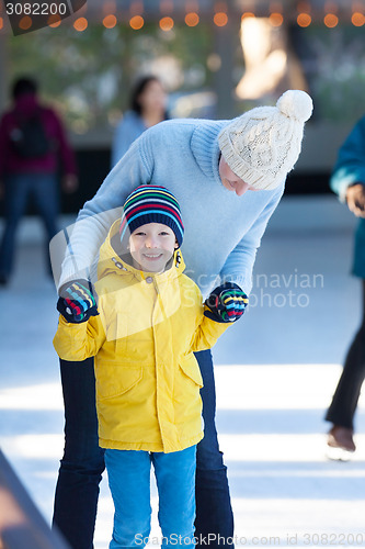 Image of family ice skating