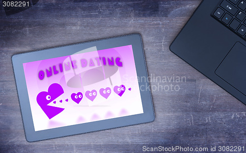 Image of Online dating on a tablet