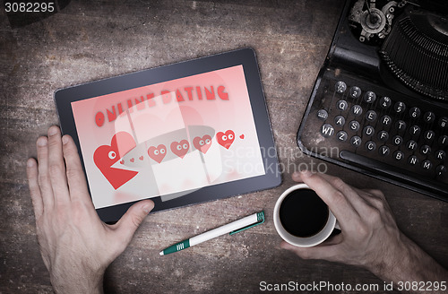 Image of Online dating on a tablet