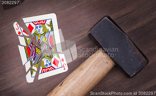 Image of Hammer with a broken card, jack of diamonds
