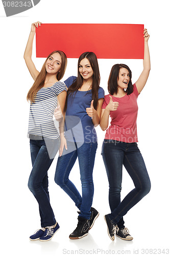 Image of Three girl friends with red banner