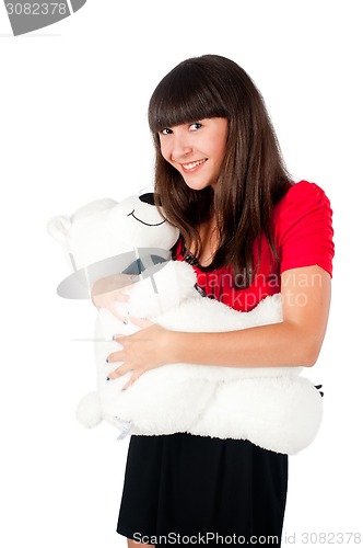 Image of Pretty girl with bear toy