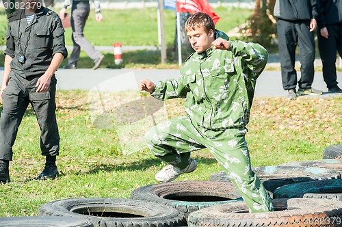 Image of Boy participates in militarized relay