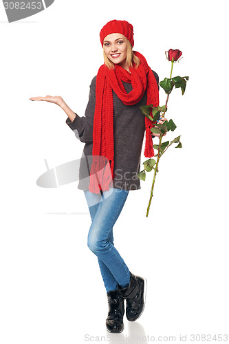 Image of Beautiful woman holding red rose