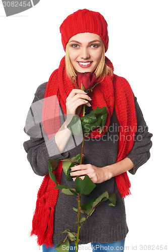 Image of Beautiful woman holding red rose