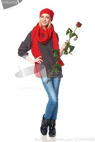 Image of Beautiful woman holding red rose