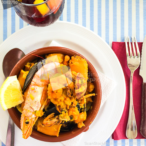 Image of Seafood dish and sangria