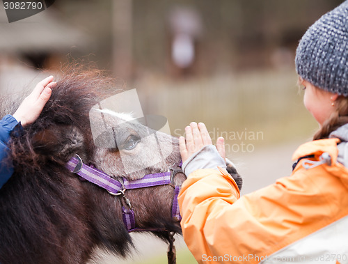 Image of Children with pony