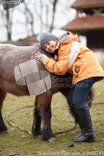 Image of Little girl with pony