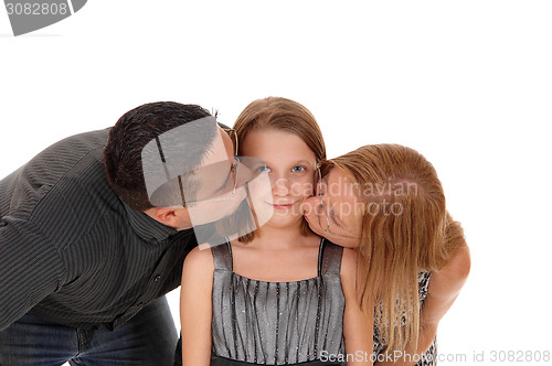 Image of Parents kissing there daughter.