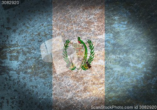 Image of Old rusty metal sign with a flag