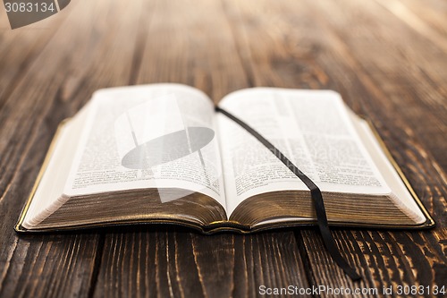 Image of Open Book on wood background