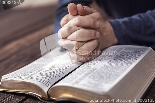 Image of Man reading the holy bible