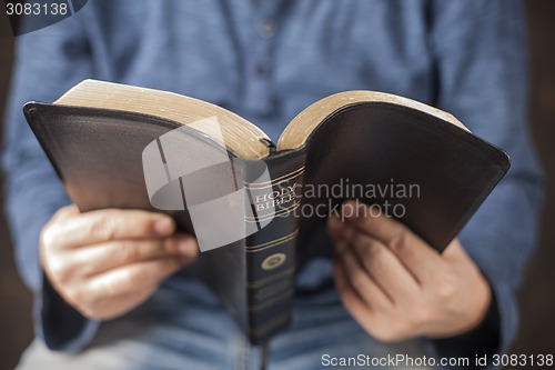 Image of Man reading the holy bible