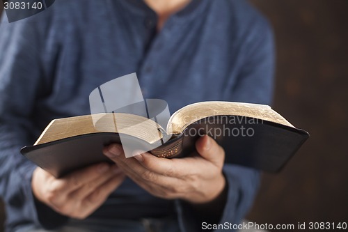 Image of Man reading the holy bible