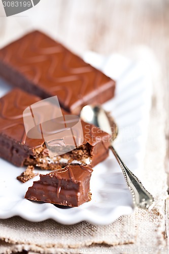 Image of dark chocolate cakes and spoon 